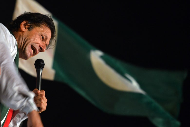 Pakistani opposition politician Imran Khan addresses his supporters during an anti-government protest in front of the Parliament building in Islamabad on August 21, 2014. Pakistani opposition politician Imran Khan on August 21, 2014 called off talks with the government aimed at ending protests seeking the fall of the prime minister, which have unnerved the nuclear-armed nation. Khan and populist cleric Tahir-ul-Qadri have led followers protesting outside parliament for the past two days demanding Prime Minister Nawaz Sharif quit. AFP PHOTO/ AAMIR QURESHI (Photo credit should read AAMIR QURESHI/AFP/Getty Images)